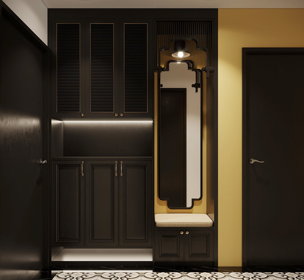 Sắc đen huyền b&iacute; tạo chiều s&acirc;u cho lối v&agrave;o căn hộ 90m2. Gương lớn gắn tường v&agrave; sắc v&agrave;ng Đ&ocirc;ng Dương cực h&uacute;t mắt.