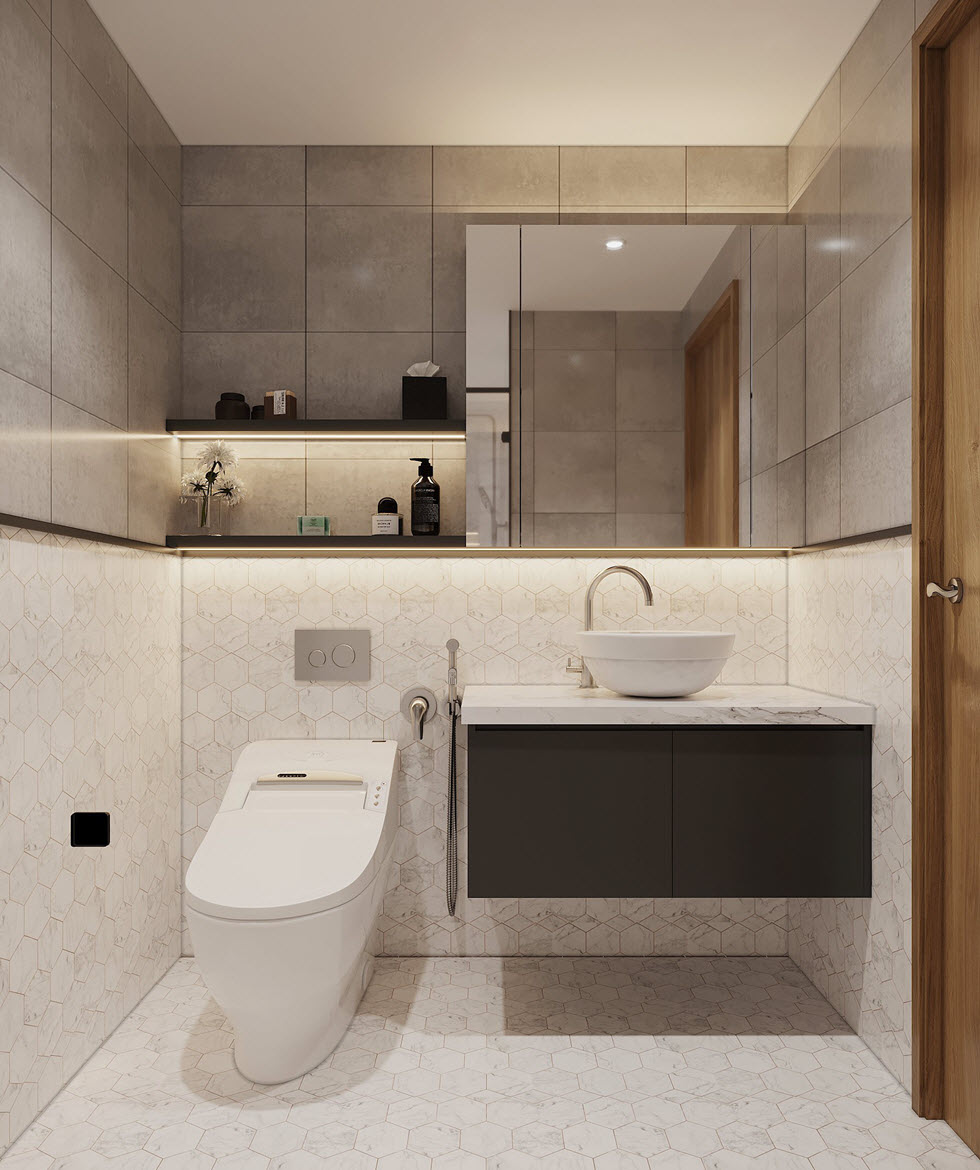 Ph&ograve;ng vệ sinh với gạch ốp m&agrave;u x&aacute;m, gương lớn gắn tường, kệ mở cung cấp kh&ocirc;ng gian lưu trữ thoải m&aacute;i
