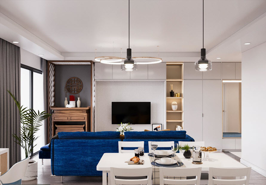 ph&ograve;ng ăn nh&igrave;n ra ph&ograve;ng kh&aacute;ch với sofa m&agrave;u xanh coban nổi bật