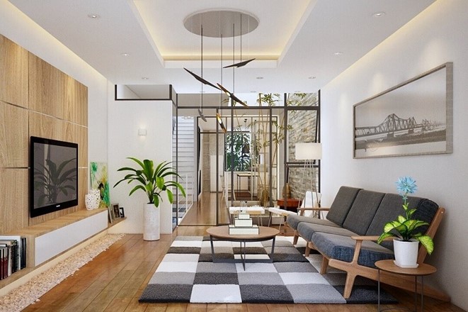 Thảm trải sàn lớn họa tiết kẻ caro xám - trắng vừa giúp định vị không gian tiếp khách, vừa tạo điểm nhấn sinh động cho căn phòng.