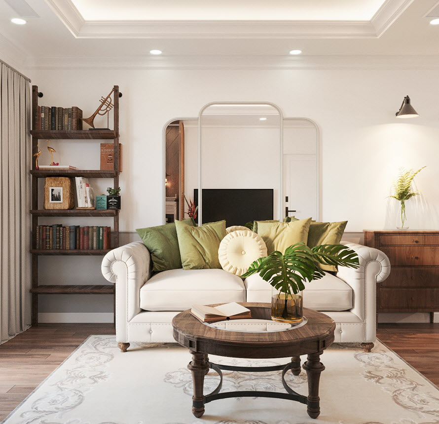 Ph&ograve;ng kh&aacute;ch phong c&aacute;ch Đ&ocirc;ng Dương với ghế sofa đơn m&agrave;u trắng sữa, gối tựa m&agrave;u xanh l&aacute;, b&agrave;n tr&ograve;n gỗ