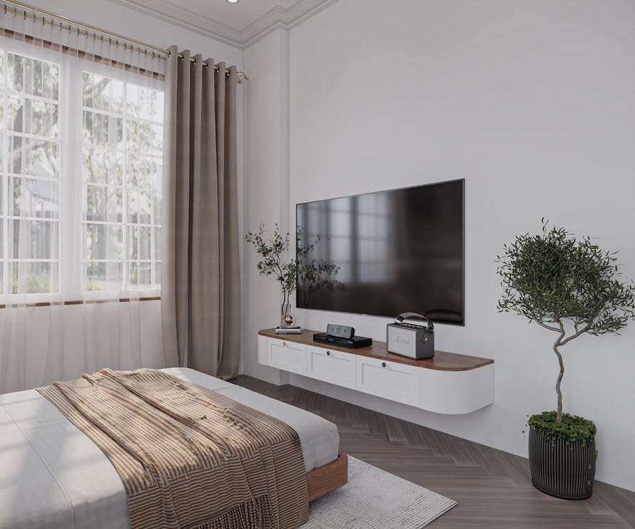 Góc phòng ngủ với tivie treo tường, cây xanh trang trí