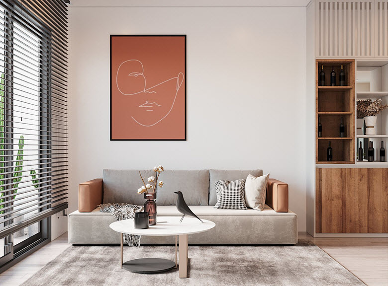 ph&ograve;ng kh&aacute;ch căn hộ với ghế sofa v&agrave; thảm x&aacute;m, cửa sổ k&iacute;nh nhiều &aacute;nh s&aacute;ng tự nhi&ecirc;n, tranh tường m&agrave;u cam đất