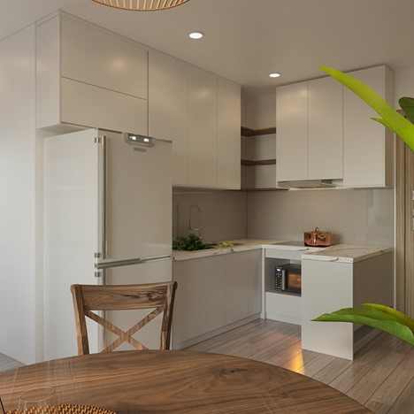 Không gian bếp nhỏ xinh với tông màu trắng ngà của tủ bếp trên và dưới mang lại cảm giác rộng rãi, thoáng sáng hơn về mặt thị giác.