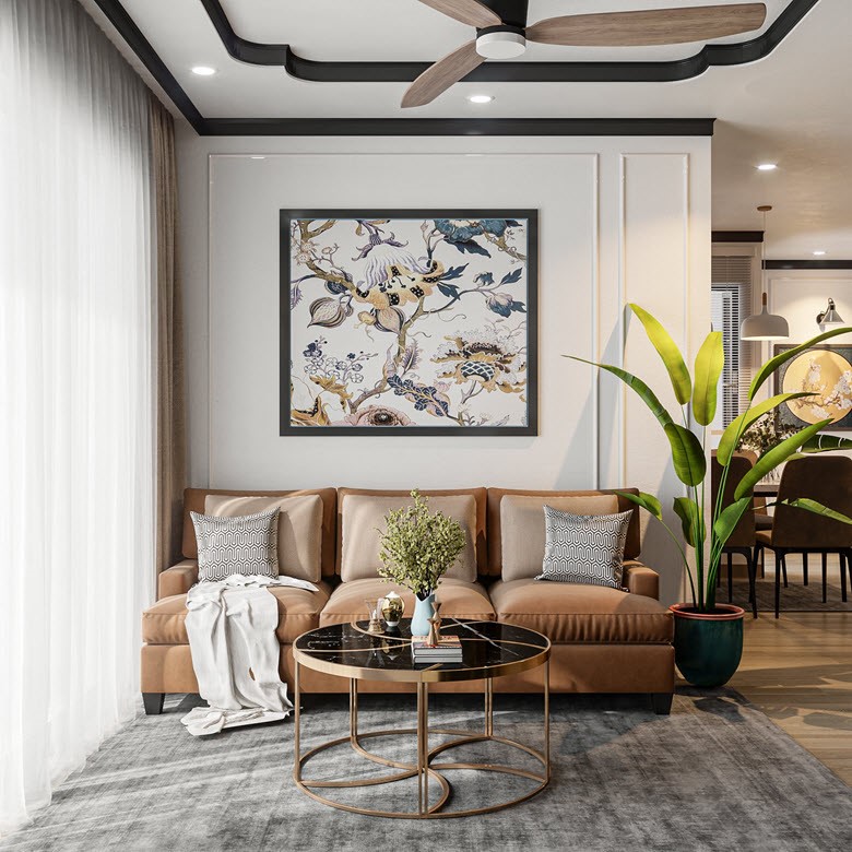 Ph&ograve;ng kh&aacute;ch nổi bật với bộ sofa da m&agrave;u n&acirc;u, b&ecirc;n tr&ecirc;n l&agrave; bức tranh được vẽ kh&eacute;o l&eacute;o. Chậu chuối cảnh b&ecirc;n cạnh sofa gi&uacute;p kh&ocirc;ng gian được dịu m&aacute;t, mang hơi thở nhiệt đới v&agrave;o căn hộ. 