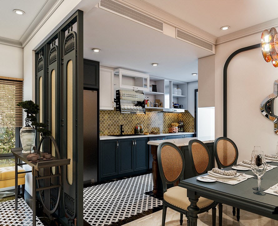 Góc trong cùng được bố trí hệ thống bếp ấn tượng với gạch mosaic vảy cá màu vàng ốp bao quanh bếp. Đối diện với bếp là khu vực đảo bếp rộng rãi, với mặt đảo được bố trí bằng đá trắng vân mây rất đẹp.