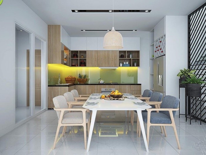 Ph&ograve;ng bếp kết hợp ph&ograve;ng ăn được thiết kế theo phong c&aacute;ch hiện đại, tấm ốp k&iacute;nh khu bếp ch&iacute;nh l&agrave; điểm nhấn cho kh&ocirc;ng gian n&agrave;y. 