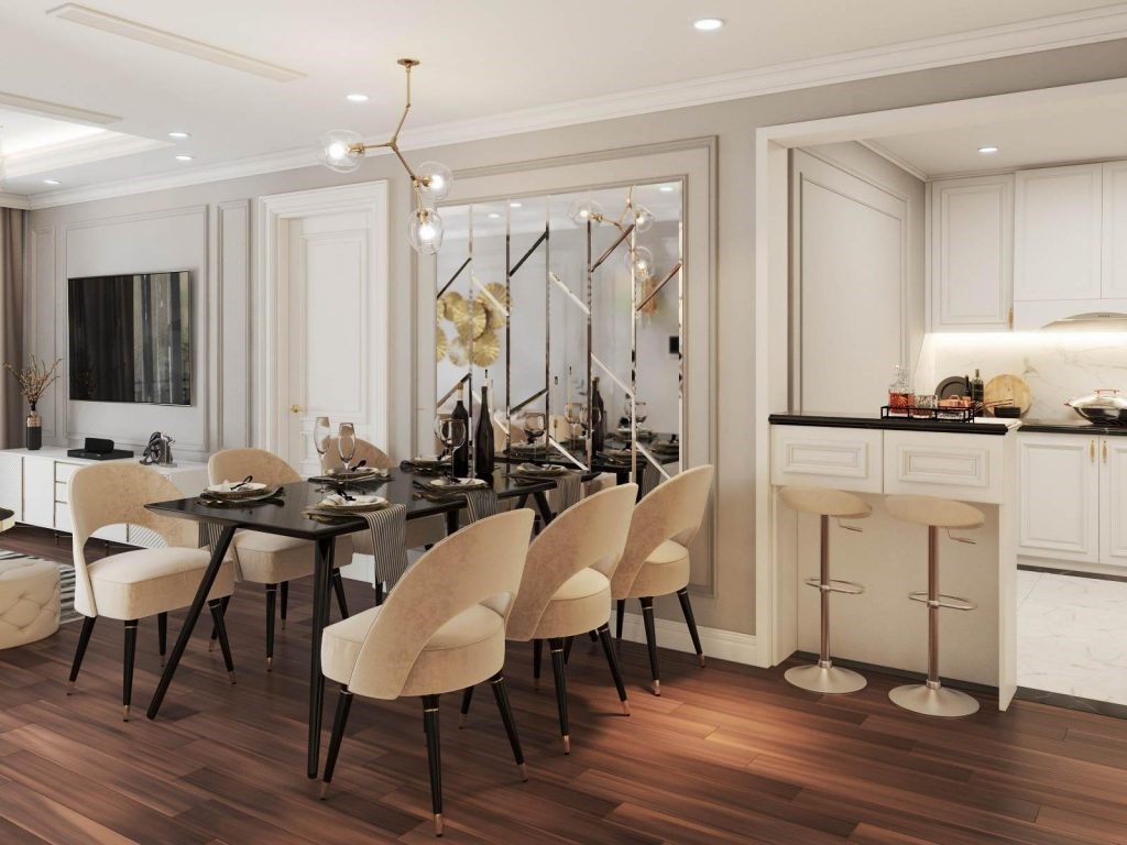 Phòng ăn và bếp ngăn cách với nhau bằng quầy bar nhỏ xinh, rất tiện lợi cho quá trình chế biến và sắp xếp bữa ăn cho gia đình. Bên cạnh bộ bàn ăn quý phái là vách kính trang trí đẹp mắt. Bên trên có điểm bông hoa decor sinh động.