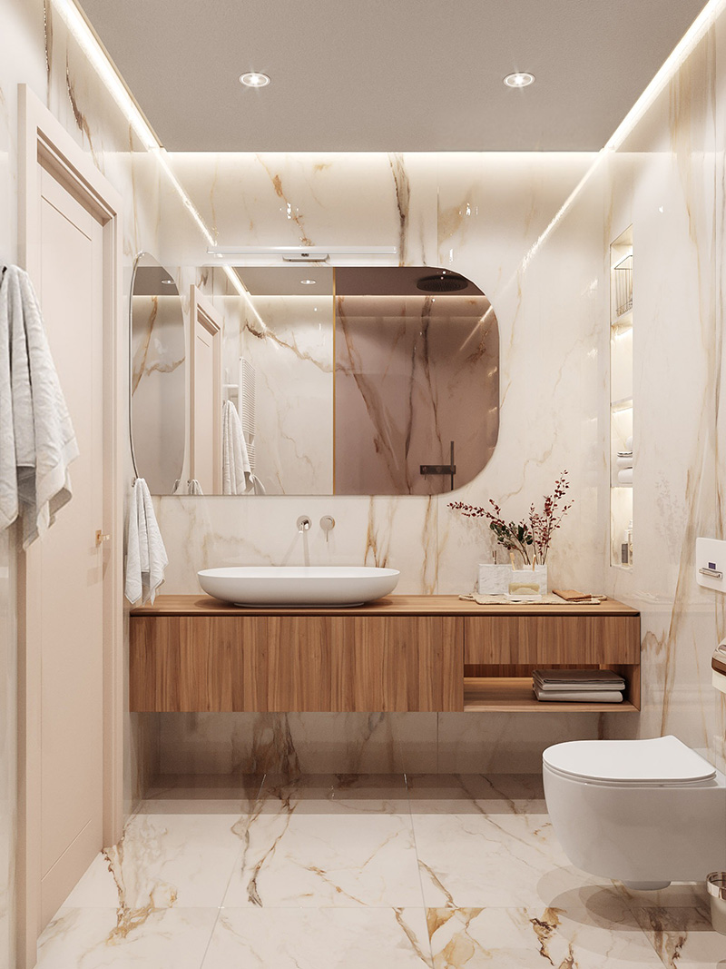 Tường ốp gạch ấn tượng kết hợp hệ đèn bố trí khéo léo giúp tổng thể phòng vệ sinh sáng hơn, sang trọng hơn.