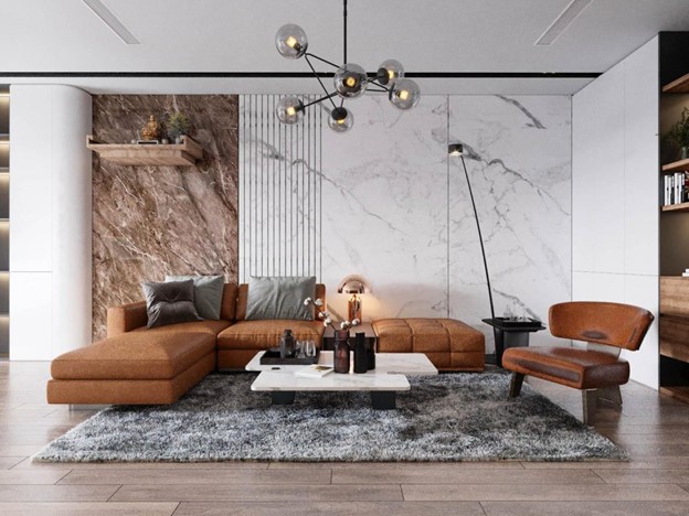 Phòng khách với bộ sofa bằng da cao cấp, vách tường vân đá sang trọng.