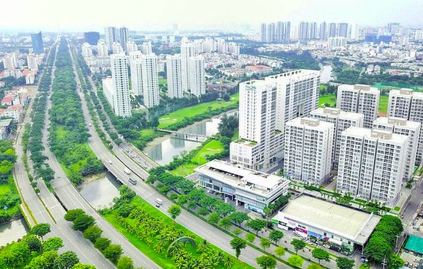 Một g&oacute;c th&agrave;nh phố nh&igrave;n từ tr&ecirc;n cao với nhiều t&ograve;a nh&agrave; chung cư cao tầng xen kẽ c&acirc;y xanh, đường phố