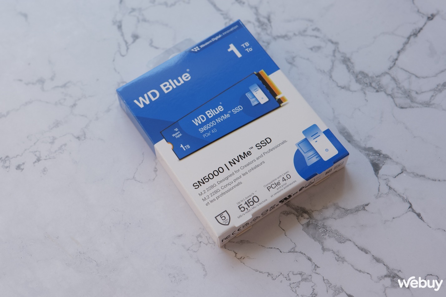 Đánh giá WD Blue SN5000 1TB: Bình mới rượu cũ nhưng vẫn đáng tiền- Ảnh 1. A box of hard drive Description automatically generated