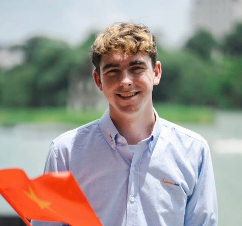 A person smiling at the camera  AI-generated content may be incorrect.