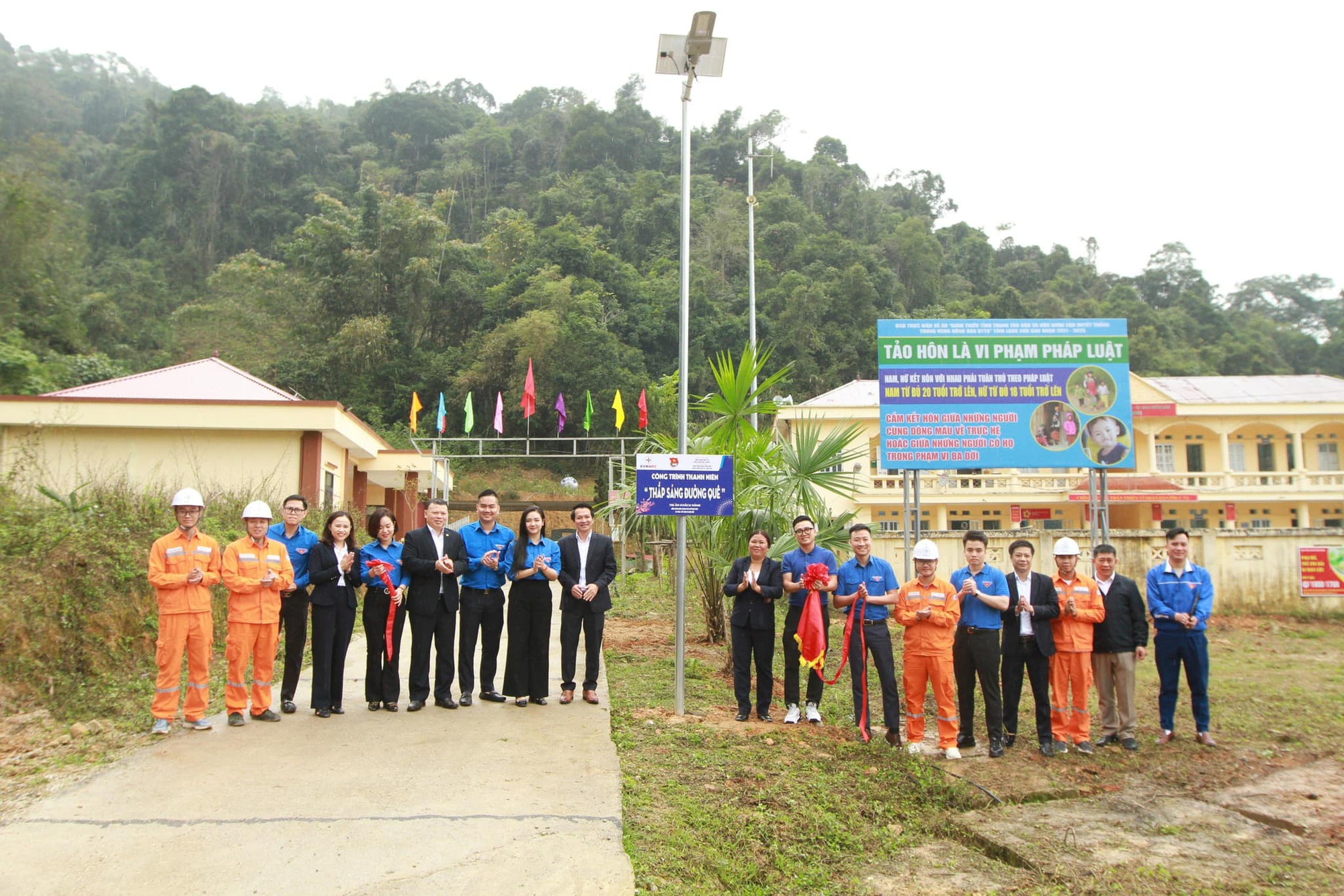A group of people standing in front of a sign  AI-generated content may be incorrect.