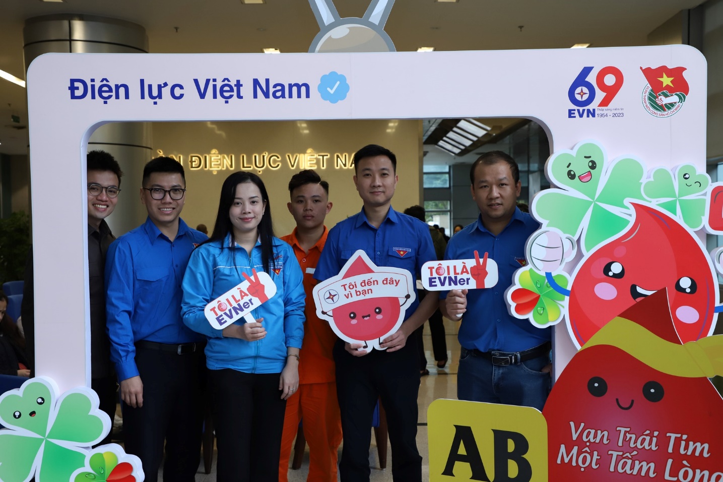 A group of people posing for a photo  AI-generated content may be incorrect.