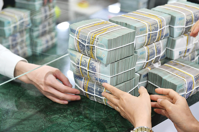 Ngân hàng nhận chuyển giao ngân hàng yếu kém được giảm 50% dự trữ bắt buộc từ 1/10- Ảnh 1.