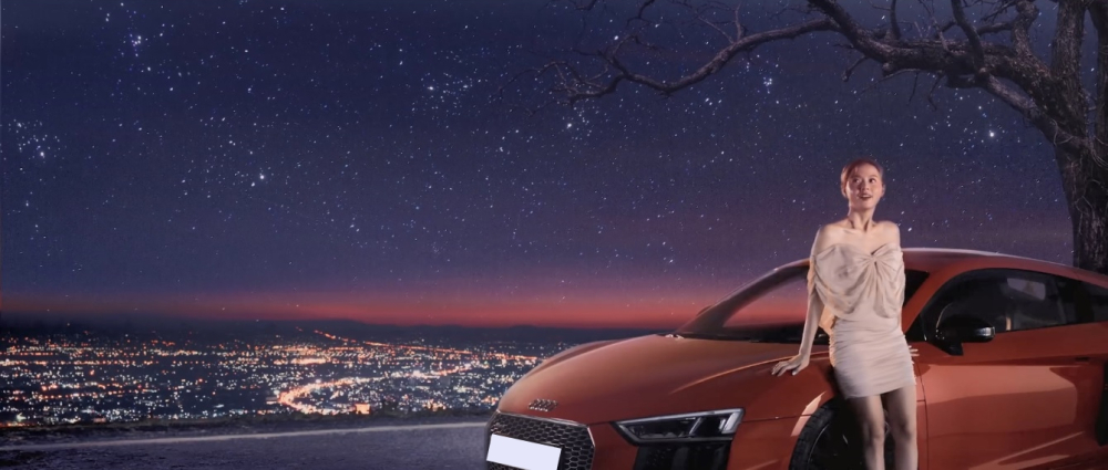 Midu cùng siêu xe Audi R8 V10 Plus trong một cảnh quay của MV Anh Nghĩ Anh Là Ai