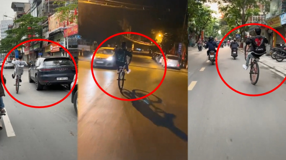 Nam thanh ni&ecirc;n điều khiển xe đạp bằng 1 b&aacute;nh tr&ecirc;n đường phố H&agrave; Nội