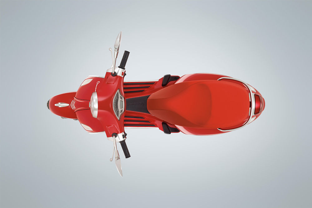 Vespa Primavera RED vẫn sở hữu những đường n&eacute;t thời trang nhưng kho&aacute;c l&ecirc;n m&agrave;u sơn đỏ rất bắt mắt.