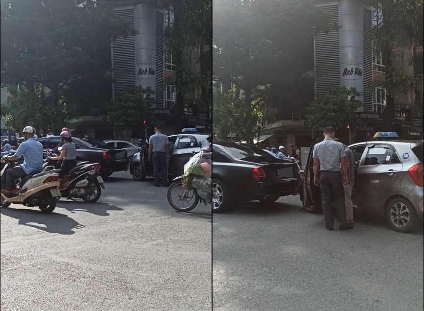 Lái xe Rolls-Royce Ghost cùng tài xế xe taxi đang giải quyết vụ va chạm giao thông