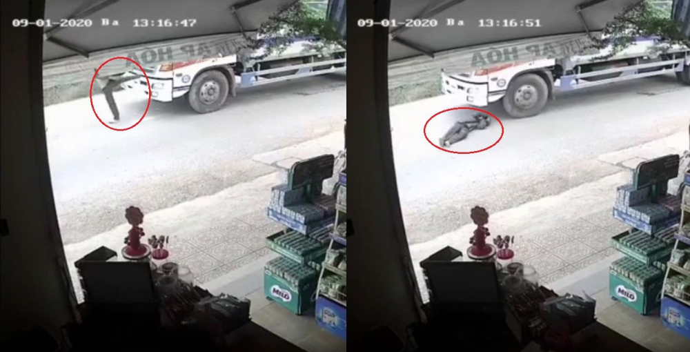Người đàn ông nghi say rượu nằm xuống đường, ngay trước bánh ô tô tải