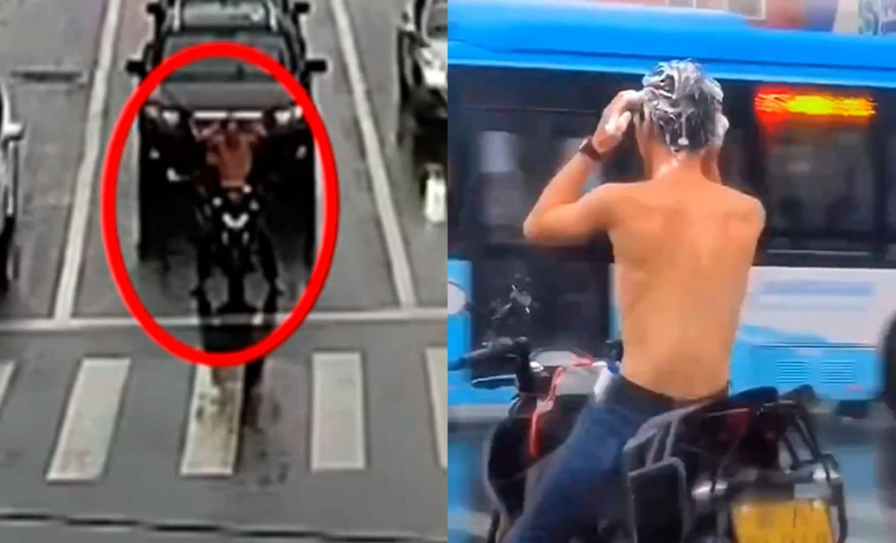 Nam thanh niên đi xe máy vừa dừng đèn đỏ vừa gội đầu