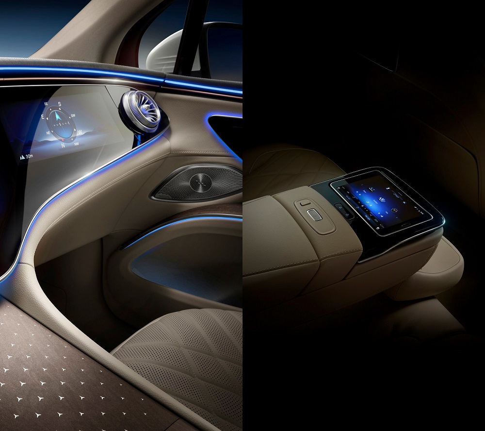 Cụm điều khiển trung t&acirc;m ở h&agrave;ng ghế đầu của Mercedes-Benz EQS SUV 2022 đi k&egrave;m chi tiết ốp gỗ trang tr&iacute; bằng họa tiết ng&ocirc;i sao 3 c&aacute;nh trong khi h&agrave;ng ghế sau c&oacute; m&agrave;n h&igrave;nh để h&agrave;nh kh&aacute;ch chỉnh c&aacute;c t&iacute;nh năng