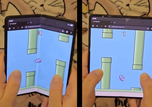 Flappy Bird phiên bản "phá" điện thoại gập: Muốn ghi điểm cao, người chơi phải... gập mở máy liên tục- Ảnh 1. Flappy Bird phiên bản "phá" điện thoại gập: Muốn ghi điểm cao, người chơi phải... gập mở máy liên tục- Ảnh 1.