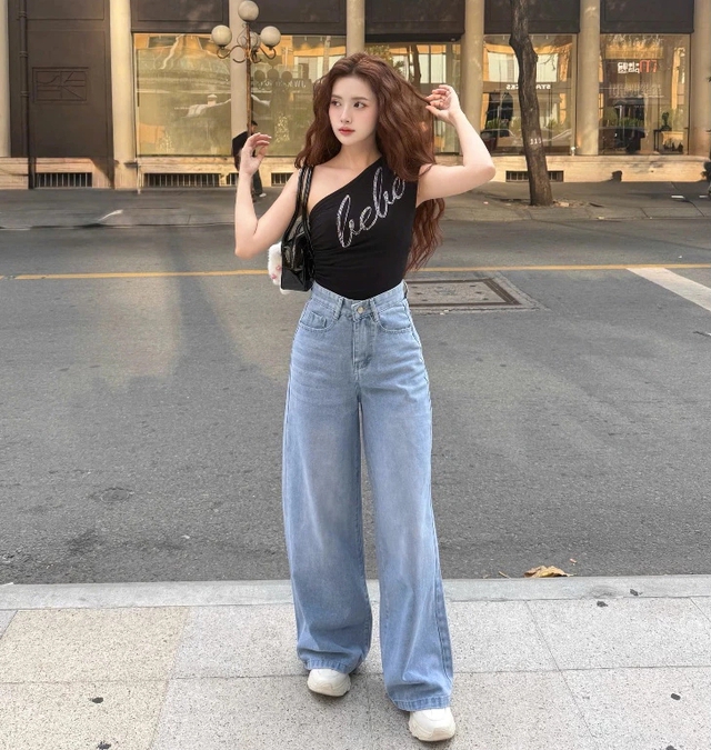 Quần jeans ống rộng vẫn là “vua” của tủ đồ năm 2026: 8 công thức phối đồ giúp bạn mặc đẹp, che khuyết điểm và trông sang hơn - Ảnh 11.