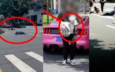 Sau tai nạn làm 3 người thương vong, thiếu gia bước xuống xe Ford Mustang với một tay ôm chó và tay cầm dù khiến dân mạng phẫn nộ