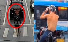 Video: Đang đi mô tô về nhà thì trời đổ mưa, thanh niên "chán đời" vừa dừng đèn đỏ vừa... gội đầu