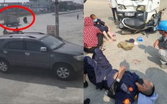 Video quay khoảnh khắc 2 bảo vệ chạy xe máy sang đường bị xe ô tô tải đâm văng ra xa