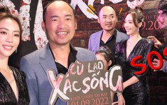 Thu Trang - Tiến Luật nắm chặt tay nhau, quấn quýt không rời dù bị hù dọa giữa thảm đỏ